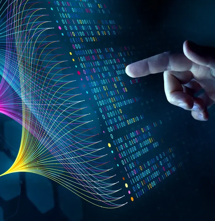 Image of finger pointing at binary code