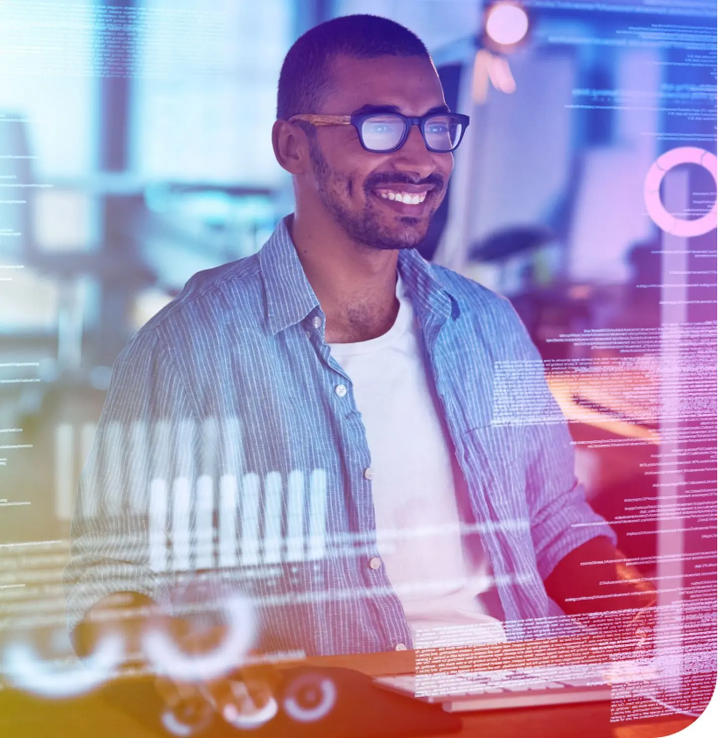 Image of man coding happily at computer